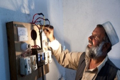 Banda Miralamji village Community Development Council (CDC) chairman showing the Micro Hydro power facilities.